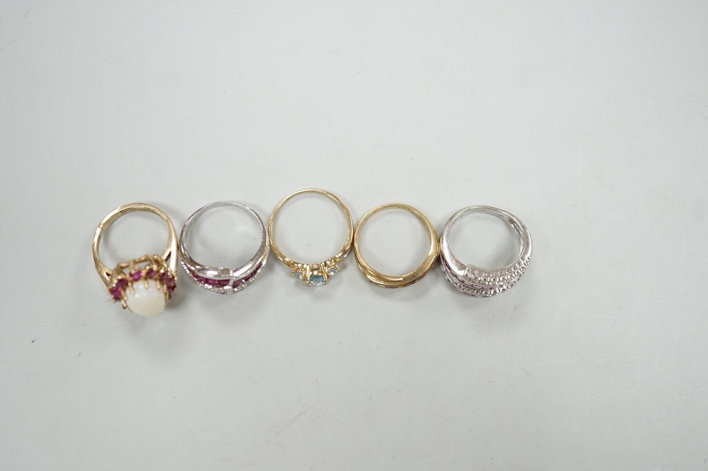 Five assorted modern 9ct gold and gem set dress rings, including ruby and diamond chip, gross weight 16.8 grams.